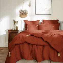 Couvre-lit à Nouettes Lin Lavé 32 Couvre-lit à Nouettes Lin Lavé -Magasin De Literie bout de lit lin orange ambiance